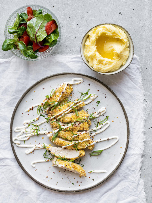Hähnchenschnitzel mit Mais-Paniermehl und Parmesan